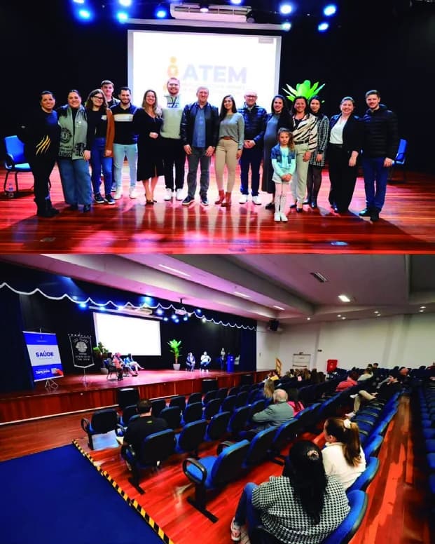 Equipe da ATEM reunida no palco durante evento da associação